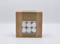 brown cardboard box packaging; white tealight candles in clear plastic cups; pack window showing multiple tealights; text indicating 9 hours burning time; simple, eco-style design;