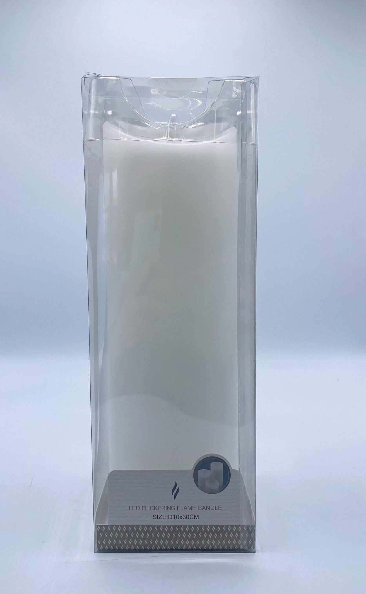 white pillar candle; plastic transparent packaging; cylindrical shape; label with size and flame icon;