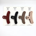 Long chain-link style claw clip; Matte finish surface; Displayed in multiple neutral and dark colours; Packaged on white backing card labelled Hair Accessories;