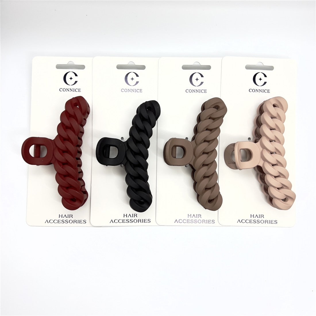 Long chain-link style claw clip; Matte finish surface; Displayed in multiple neutral and dark colours; Packaged on white backing card labelled Hair Accessories;