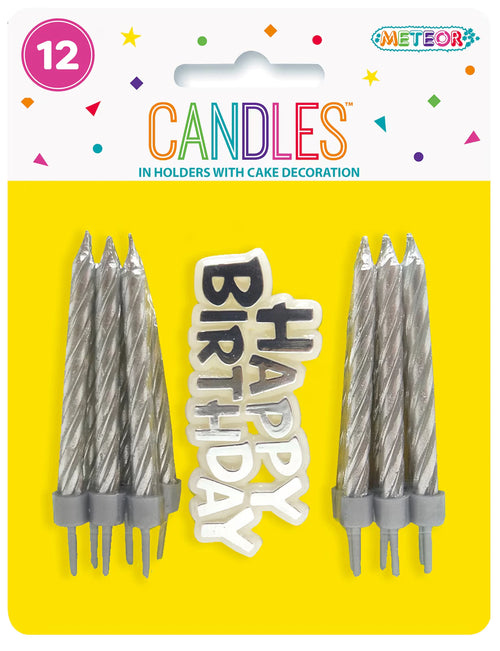 silver twisted candles; plastic holders; white 'Happy Birthday' cake decoration with black and silver lettering; yellow and white packaging with colourful confetti graphics;