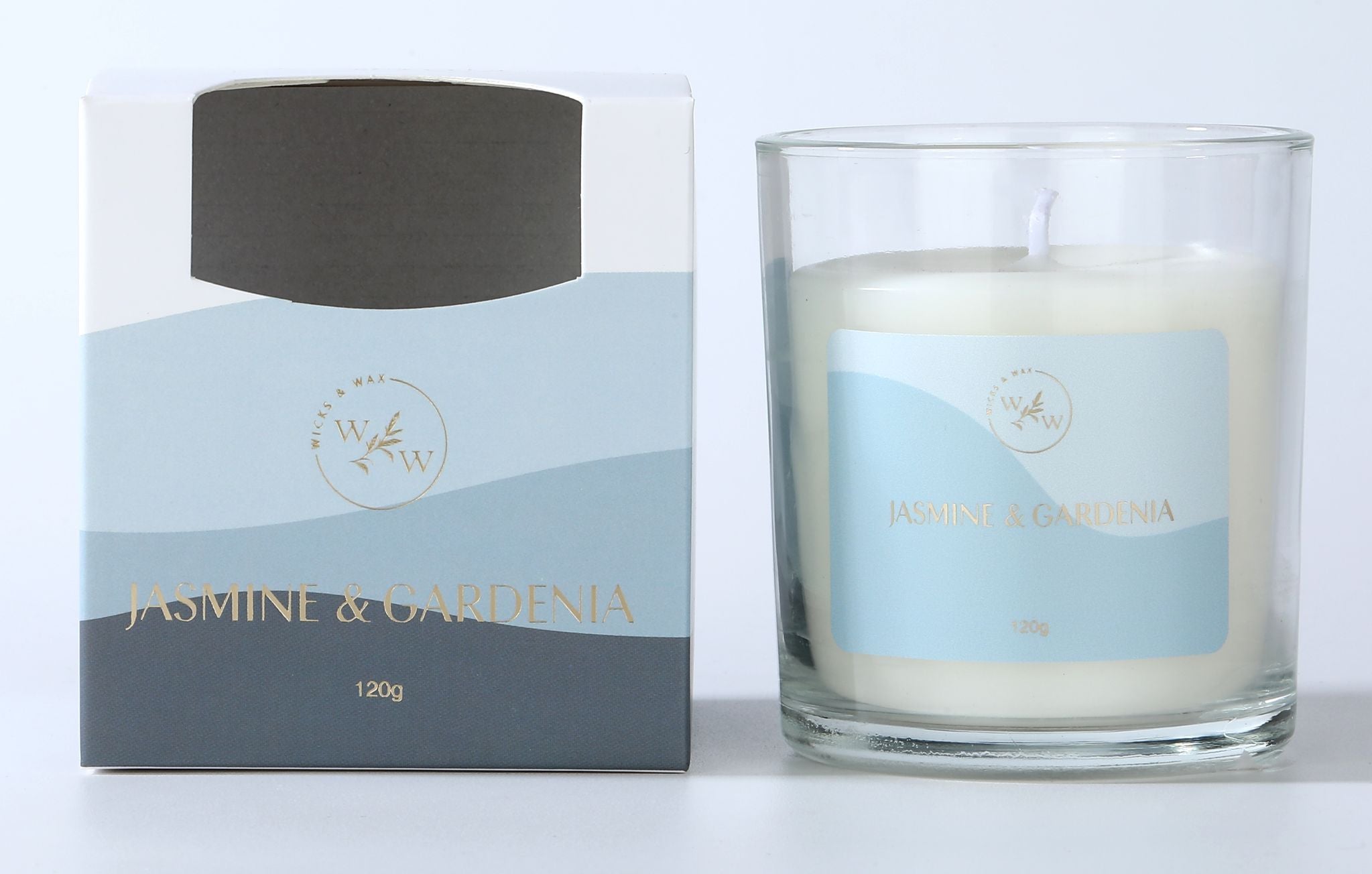 white wax candle in clear glass jar; blue label with gold text; candle weighs 120g; packaged in blue and grey cardboard box;