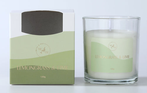 clear glass container; white candle wax; green label with gold text; two-tone green cardboard box packaging; 120g indicated on label and box;