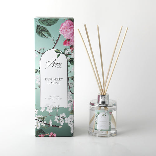 150ml clear glass diffuser bottle; silver metal collar; natural coloured reed sticks; floral patterned packaging in green and pink tones; label with raspberry & musk scent text;