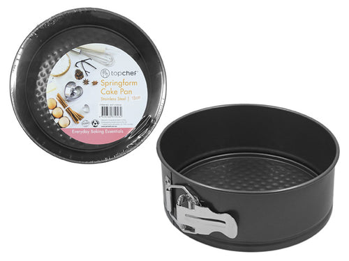 black round cake pan; non-stick textured base; metal latch on side; smooth inner surface; packaged with label featuring baking imagery;