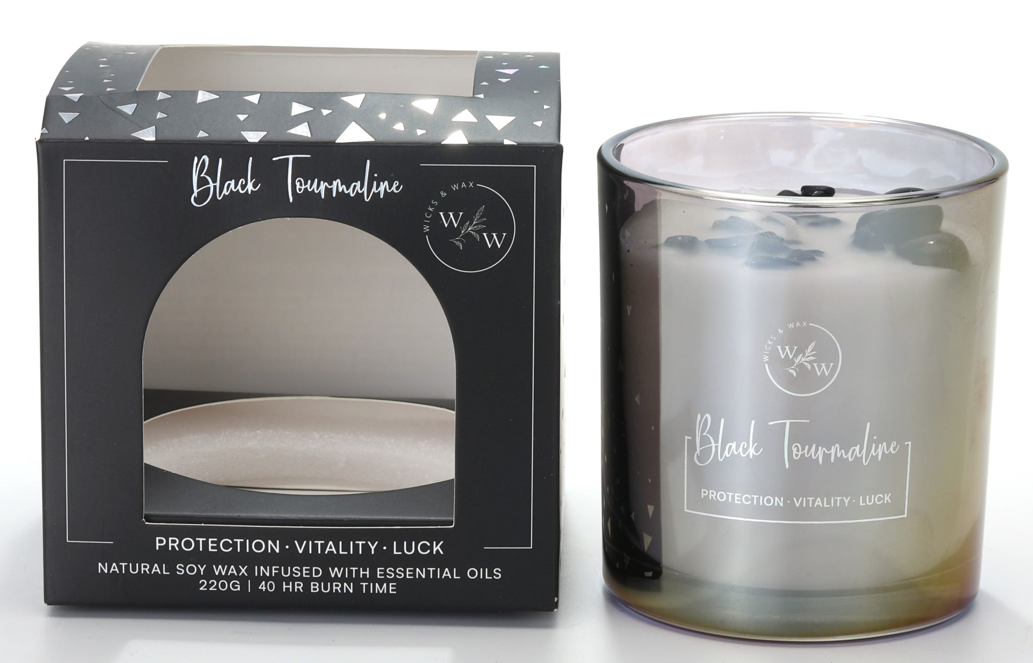 Black tinted glass jar; White candle wax with black tourmaline stones on top; Black and silver cardboard packaging with window; Text on packaging: 'Black Tourmaline', 'Protection Vitality Luck'; 220g size indicated with 40 hour burn time;
