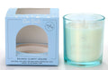 Light blue box with 'Clear Quartz' text; Clear glass candle holder with light blue tint; White candle wax with clear quartz crystals embedded on top; Label mentions 'Balance Clarity Healing' and 40 hour burn time;