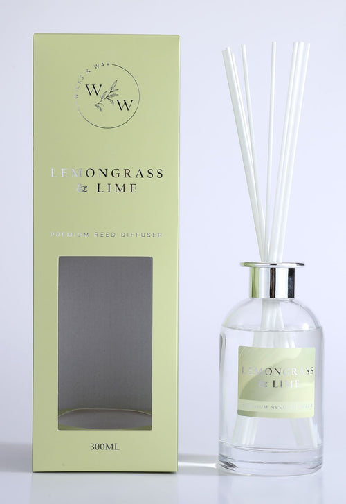 light green rectangular box packaging; clear glass diffuser bottle; silver metallic collar on bottle neck; white reed sticks inside diffuser bottle; label on bottle matches box colour and branding;