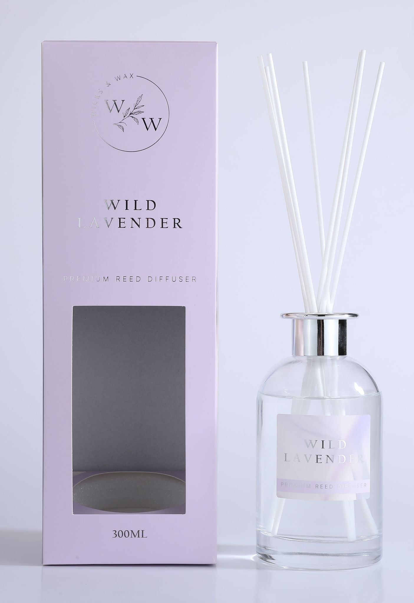 pale lavender-coloured box with silver foil text; clear glass bottle with silver collar; white diffuser reeds; label with wild lavender text;