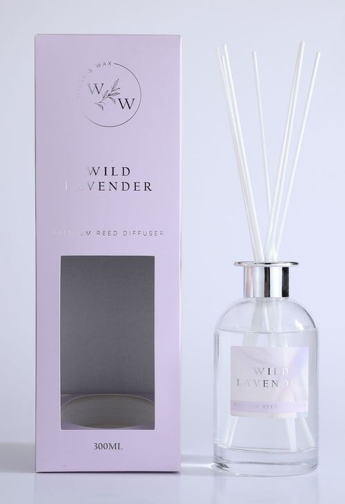 pale lavender-coloured box with silver foil text; clear glass bottle with silver collar; white diffuser reeds; label with wild lavender text;