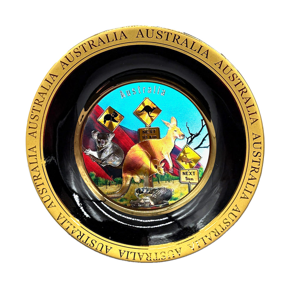 round plate shape; 3D centre design with Australian animals; black and gold coloured rim; bright blue background in centre;