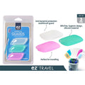 Set of 3 silicone toothbrush covers; Colours: white, green, pink; Silicone material with smooth finish; Packaged in clear plastic with blue backing; Product name 'toothbrush GUARDS' visible;