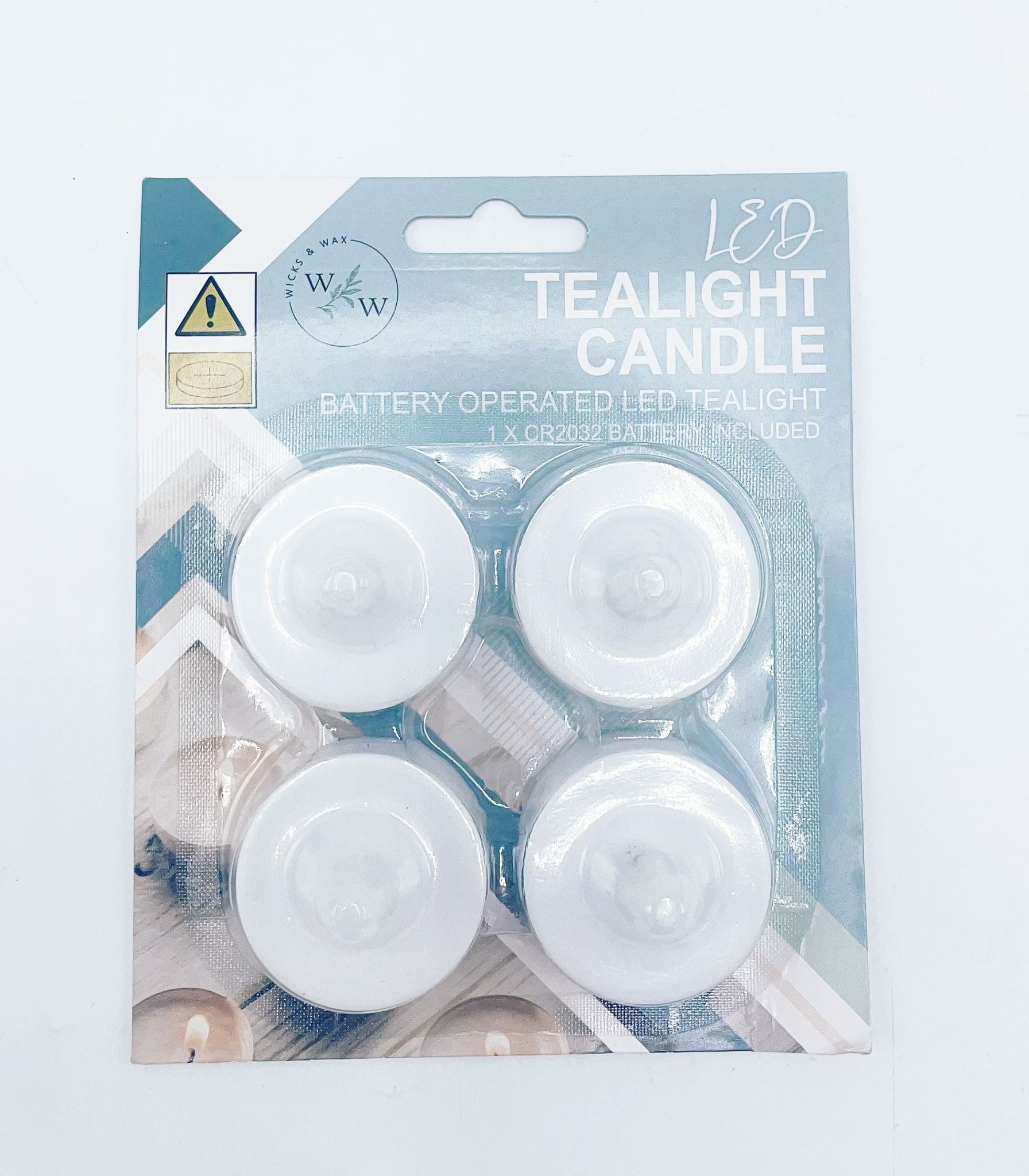 4 pack of white LED tealight candles; packaging includes blue and beige tones; battery operated with battery included; round shape with domed top;