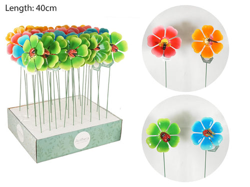 flower-shaped stakes; bright colours including green, blue, red, orange; metal stems; decorative ladybug on flower centre;