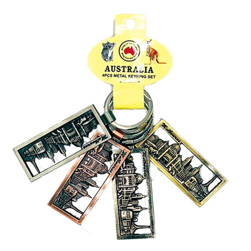 4 metal keyrings on a single loop; rectangular shape with city skyline cutout designs; various metallic colours: silver, bronze, copper, gold tones; yellow branded Australian packaging with kangaroo and koala logos;
