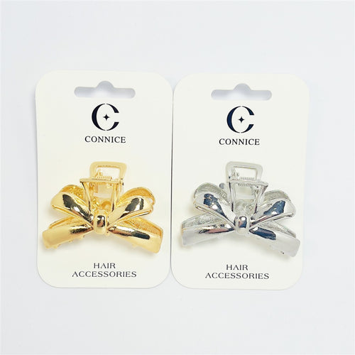 Metallic bow-shaped hair claw clips; One gold-tone and one silver-tone clip shown; Mounted on white backing cards branded "Connice"; Curved bow loops with central knot detail;