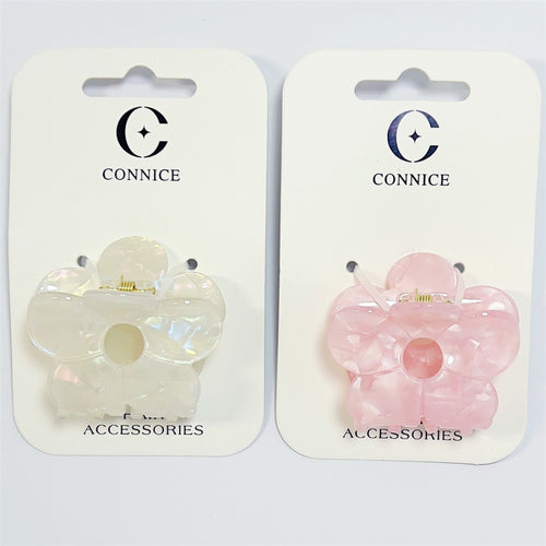 Flower-shaped claw clip design; One clip in pearlescent white, one in light pink; Glossy acrylic finish with marbled effect; Gold-tone metal spring mechanism; Mounted on white CONNICE branded backing cards;