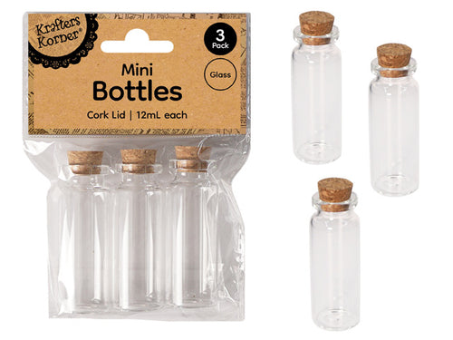 clear glass bottles; cylindrical shape; cork lids; pack of 3 bottles in plastic packaging; each bottle approx. 6cm high;