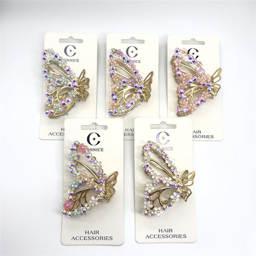 Gold-tone butterfly-shaped claw clip; Decorated with small flower beads and rhinestones; Iridescent and pastel pink accents; Mounted on white branded backing card; Approximate length around 7.5cm;