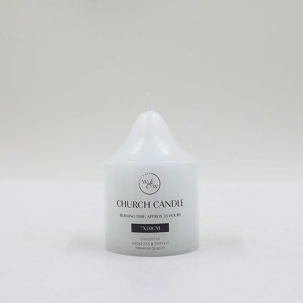 white candle; church candle shape; cylindrical with tapered top; printed text on candle body;