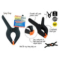 black spring clamp; 85mm length; orange soft pads on jaws; textured grip area; plastic material;