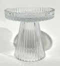Clear transparent ribbed glass material; Short pedestal style candle holder; Circular top with ridged edge; Compact size approximately 9.8x9.7cm;