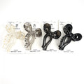Bow-shaped claw clip design; Approx. 9cm long clip; Shown in translucent neutrals and solid black; Packaged on branded backing card with text ‘Durable Lightweight Stylish’;