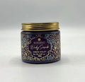 purple body scrub in jar; golden screw lid; decorative label with blue and gold leaf pattern; 280g size info on label;