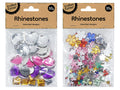 clear plastic packaging with cardboard header; variety of rhinestone shapes including flowers, stars, and gems; multiple colours including pink, purple, yellow, blue, green and clear; shiny and reflective surface;