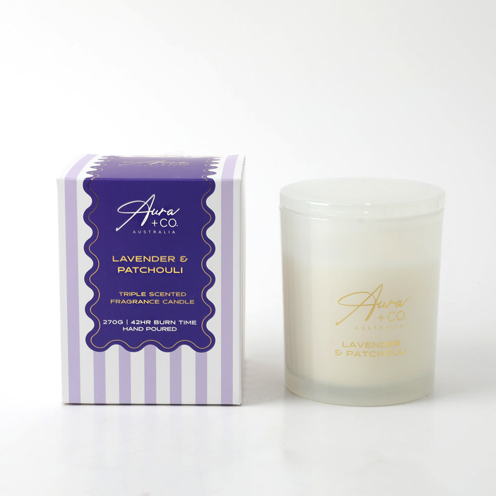 Frosted glass jar with gold lettering; White lid matching the jar; Purple and white striped box with gold and white text; 270g size label on box; Candle wax white in colour;