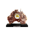 Copper-toned Australia-shaped clock face; Embossed Australian cities and animals; Black rectangular stand base; "AUSTRALIA" text on base;