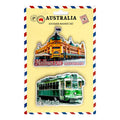 Two PVC magnets on yellow backing card; One magnet shows Melbourne building with flag; Second magnet shows green Melbourne tram with Australia text; Card backing has Australia themed graphic border; Bright, detailed colour prints on magnets;