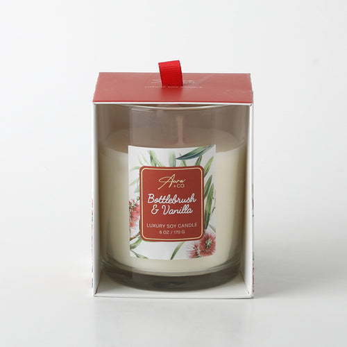 Clear glass jar container; Red top lid with pull tab; Label with bottlebrush floral design; White coloured candle wax; Packaged in box with open front;