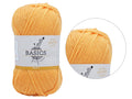 Apricot colour yarn; Twisted yarn texture; Paper label with BASICS branding; Compact skein shape;
