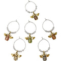 gold bee-shaped charms with coloured gems in pink, green, orange, clear, blue, and purple tones; clear round beads on silver metal wire loops; each charm is attached to a hoop for hanging on wine glasses; charms feature detailed bee design with wings and body segments;