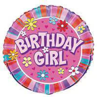 round pink foil balloon; multicoloured flower designs; "Birthday Girl" text in large letters; striped pink border around edges;