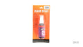 Orange blister-card packaging; Purple bottle label with Halloween graphics; Dark-coloured bottle; White spray pump;