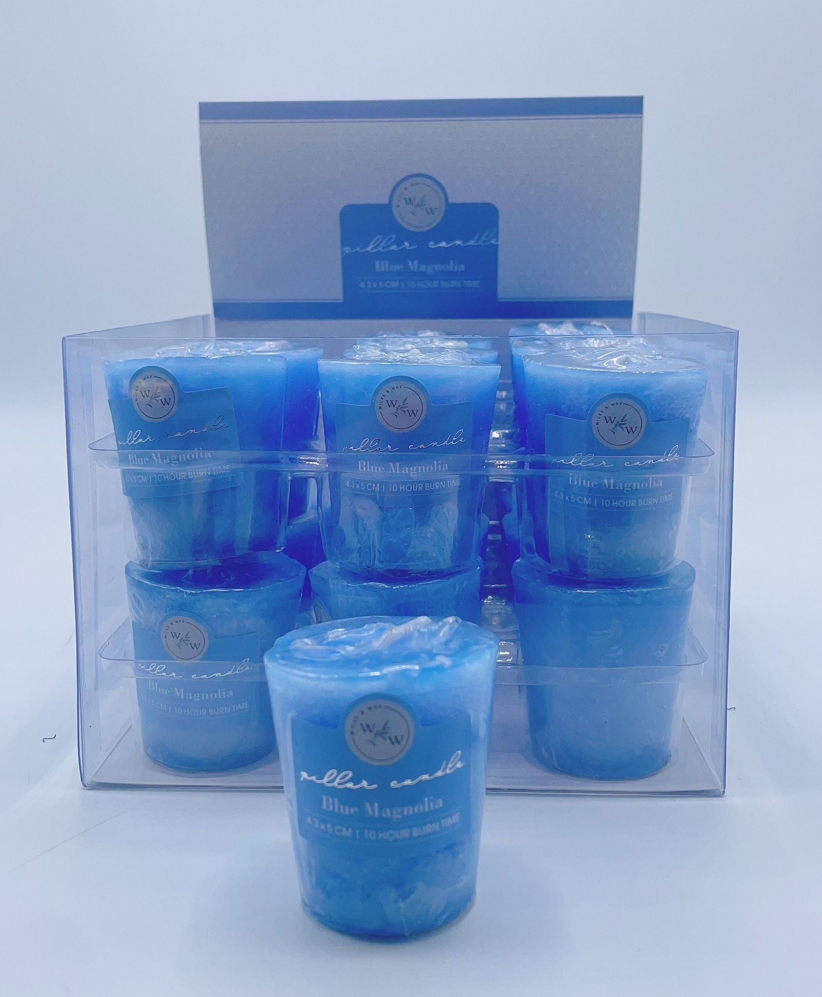 solid blue colour; small votive shape; compact size; packaged in clear plastic box; blue magnolia label;
