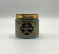 green decorative label with floral and paisley patterns; gold screw-top lid; glass jar; 200ml volume indicated on label;