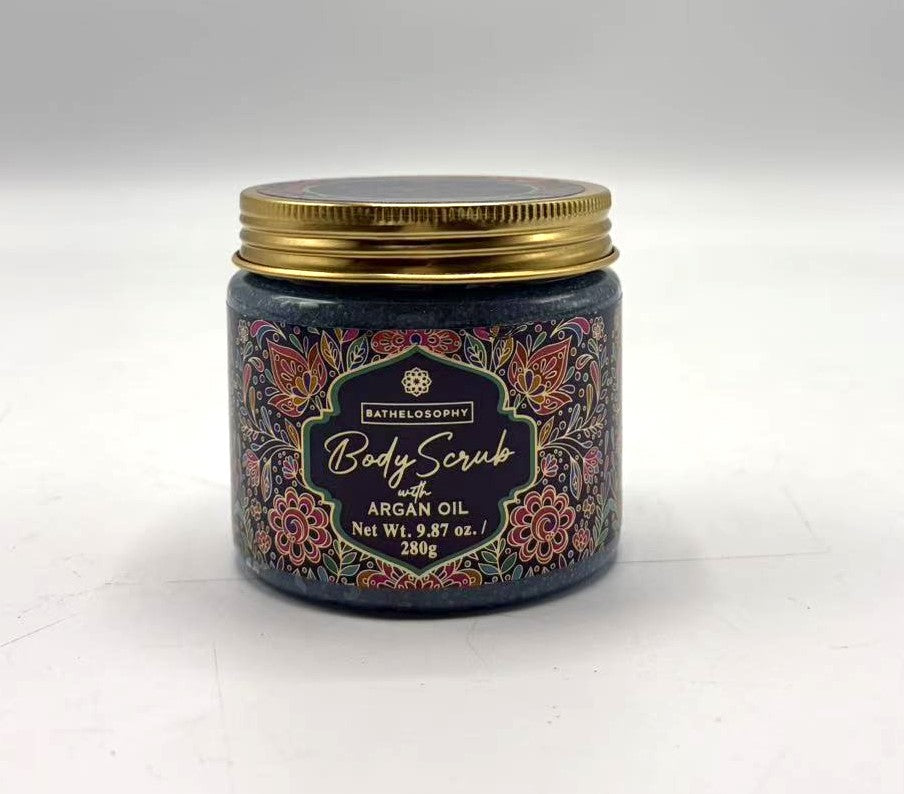 jar container with decorative floral label; gold screw-top lid; dark coloured scrub visible through glass; label includes cream and pink floral designs;