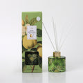 green glass bottle with botanical pear and flower print; gold coloured collar on diffuser bottle; white reed sticks inserted in the diffuser; outer box with matching botanical pear and flower design; green and gold colour scheme on packaging;