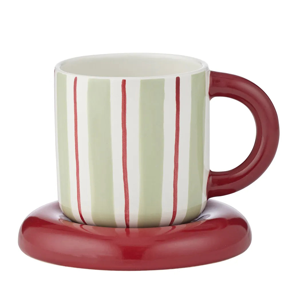 Ceramic cup with vertical mint green and white stripes; Russet red handle and matching saucer; Compact size, approximately 13cm cup height and 10cm saucer diameter; Glossy finish on cup and saucer;