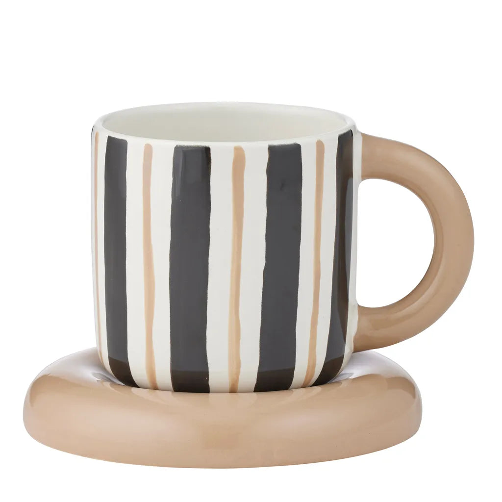 black and natural vertical stripe pattern on cup; round natural-coloured handle; smooth ceramic finish; matching natural-coloured rounded saucer;