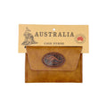 brown faux leather material; kangaroo emblem on front; flap closure; compact rectangular shape; packaged with Australia themed cardboard tag;