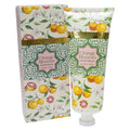100ml tube packaging; Decorative floral and fruit pattern; Green and gold decorative label; Predominantly white background with orange and green accents;