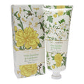 White tube with floral print in yellow and green; Matching floral patterned box; Gold accents on packaging; 100ml size shown on tube; Screw-on white cap;