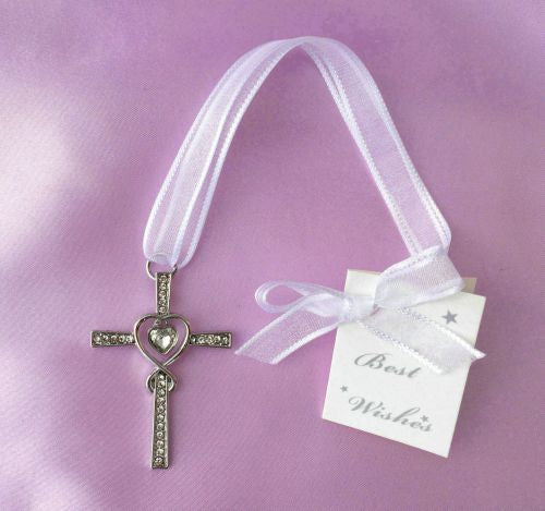 silver-tone metal cross with clear stones; heart shape in centre; white fabric hanging ribbon; attached white gift tag with ribbon bow;