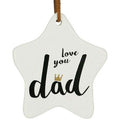 white ceramic star shape; black script text reading 'love you dad'; small gold crown detail on letter 'a'; brown leather-style hanging strap;