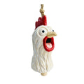 White ceramic rooster head with textured feather detail; Bright red comb and open red beak/mouth; Black and white wide eyes giving a quirky look; Hanging from a thick natural rope loop; Small wooden clapper piece visible at the base;