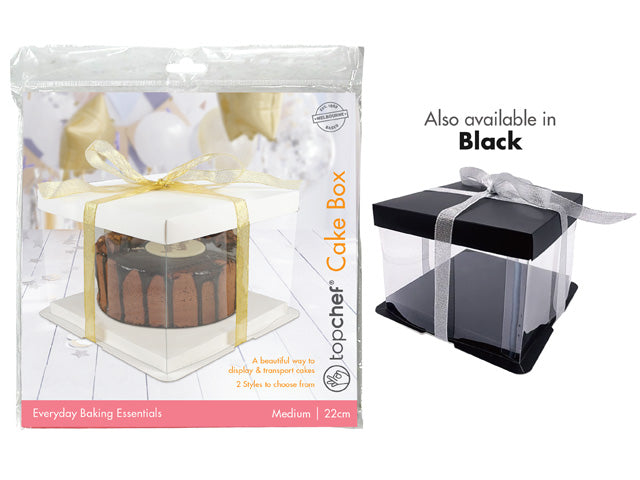 transparent box with clear walls; white square base; gold ribbon tied around; packaging shows cake inside; also available with black base;